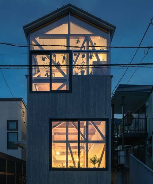 yoshichika takagi tops narrow dwelling in hokkaido with 'greenhouse' kitchen