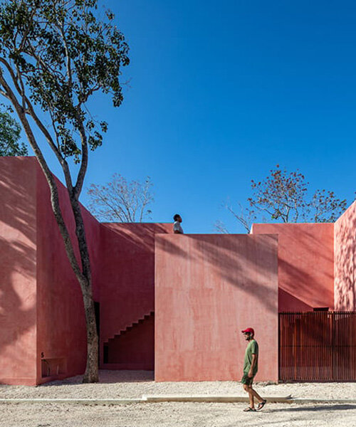 cluster of red volumes woven with green pockets compose coyote arquitectura's tulum home