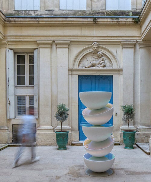 vicente spínola's totem installation stacks reflective semispheres, pondering the climate crisis